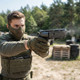 Umarex Elite Force H8R Gen2 CO2 Gas-Powered Airsoft Revolver in Black (2.6446), aimed outdoors by a masked player