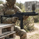 Vorsk VMP-2SD Gas Blowback Submachine Gun with Folding Stock in Black (Semi & Full-Auto) held beside pallets