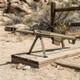 Snow Wolf Barrett M82 CQB Airsoft Sniper Rifle AEG with bipod in Tan, side view on a wooden platform