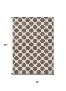 5' X 8' Brown And Ivory Polka Dot Washable Indoor Outdoor Area Rug - 880016622539