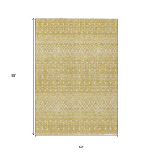 5' X 8' Gold Ivory And Taupe Tribal Washable Indoor Outdoor Area Rug