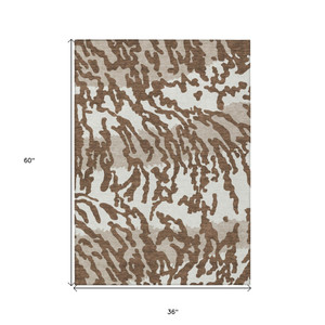 3' X 5' Chocolate Beige And Ivory Animal Print Washable Indoor Outdoor Area Rug