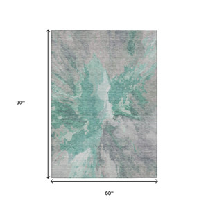 5' X 8' Teal Blue And Lavender Abstract Washable Indoor Outdoor Area Rug