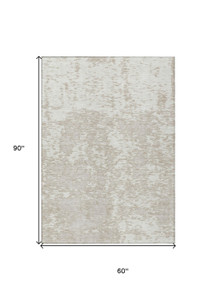 5' X 8' Ivory And Off White Abstract Washable Indoor Outdoor Area Rug