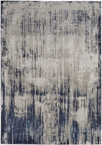 10' X 13' Tan Blue And Ivory Abstract Power Loom Distressed Area Rug
