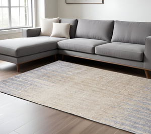 8' X 10' Tan And Blue Abstract Distressed Area Rug