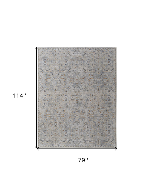 7' X 10' Ivory Tan and Blue Abstract Power Loom Worn Faded Area Rug With Fringe