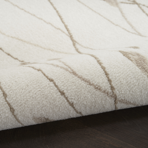 8' X 10' Beige and Ivory Floral Power Loom Area Rug