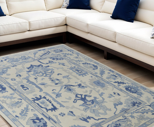 9' X 13' Ivory and Blue Wool Floral Hand Knotted Area Rug With Fringe