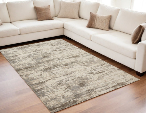 5' X 8' Ivory And Brown Abstract Area Rug