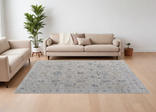 8' X 10' Ivory Taupe and Blue Floral Power Loom Worn Faded Area Rug With Fringe