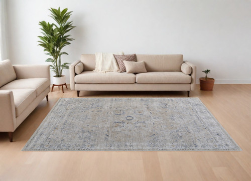 8' X 10' Ivory Taupe and Blue Oriental Power Loom Worn Faded Area Rug With Fringe