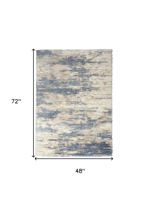 4' X 6' Light Blue Gray and Beige Abstract Shag Area Rug