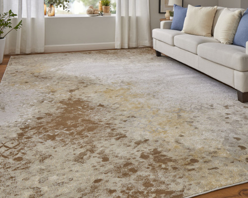 2' X 3' Tan and Ivory Abstract Power Loom Worn Faded Area Rug
