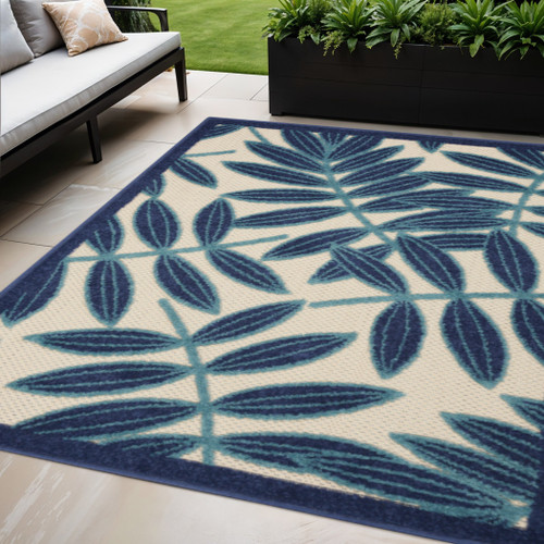 5' X 8' Navy Blue And Ivory Palm Leaf Indoor Outdoor Area Rug