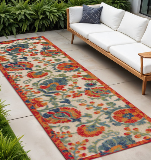 8' Ivory Orange Blue And Green Floral Indoor Outdoor Runner Rug