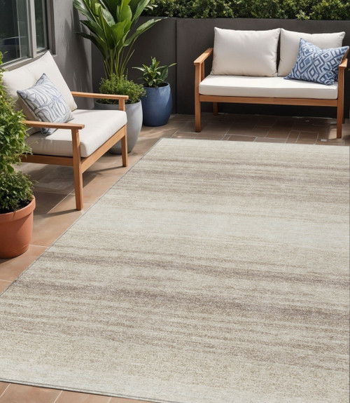 5' X 8' Ivory And Beige Abstract Washable Indoor Outdoor Area Rug