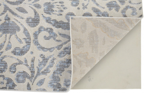 5' X 8' Blue Ivory And Tan Floral Distressed Stain Resistant Area Rug