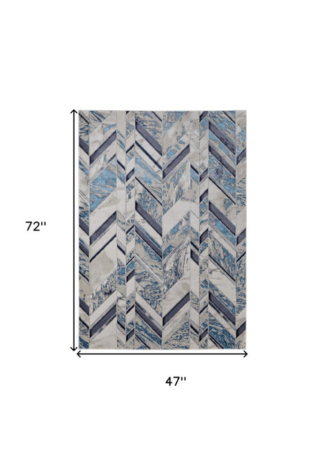 Homeroots Home Decor 4' X 6' Ivory and Blue Chevron Power Loom Distressed Area Rug