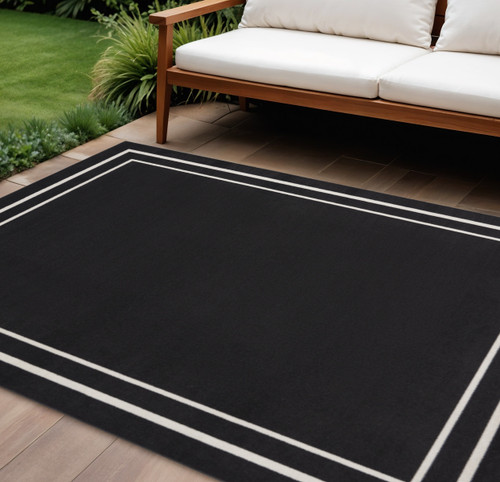 10' X 14' Black And Ivory Indoor Outdoor Area Rug