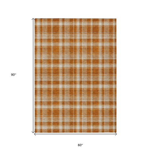5' X 8' Orange and Ivory Plaid Washable Non Skid Indoor Outdoor Area Rug