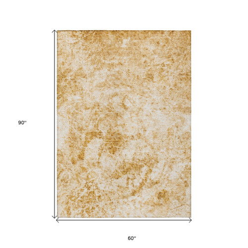 5' X 8' Cream and Gold Abstract Washable Non Skid Indoor Outdoor Area Rug