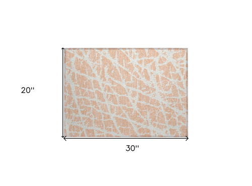 2' X 3' Peach and Ivory Abstract Washable Non Skid Indoor Outdoor Area Rug