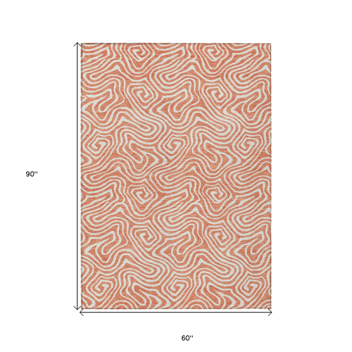 5' X 8' Salmon And Ivory Abstract Washable Indoor Outdoor Area Rug