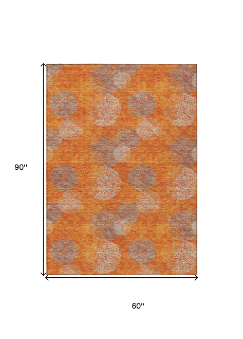 5' X 8' Orange Silver And Peach Polka Dot Washable Indoor Outdoor Area Rug