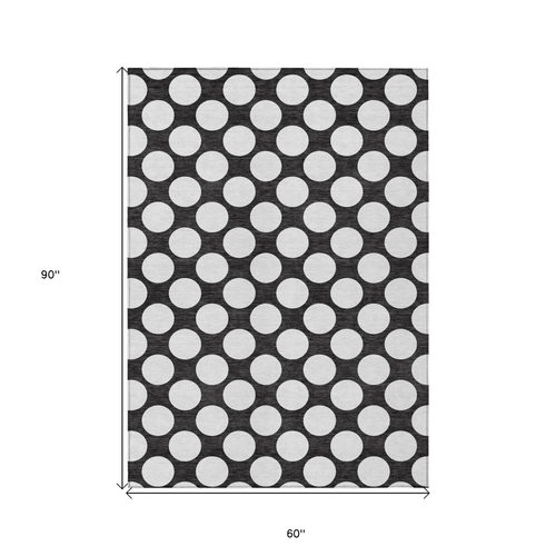 5' X 8' Black And Ivory Polka Dot Washable Indoor Outdoor Area Rug