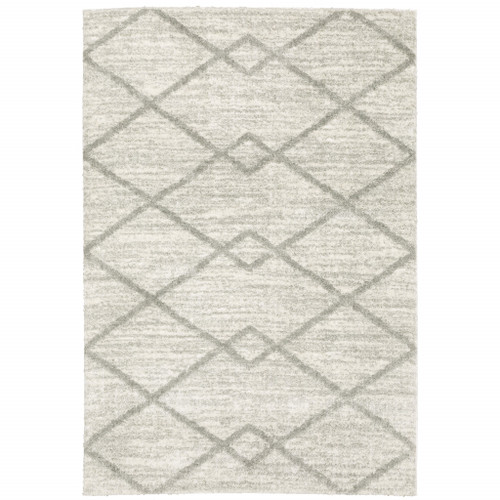 5' X 8' Ivory And Grey Geometric Shag Power Loom Stain Resistant Area Rug