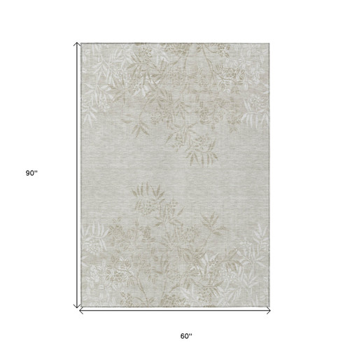 5' X 8' Beige Tan And Ivory Floral Washable Indoor Outdoor Area Rug