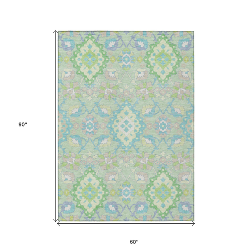 5' X 8' Mint Green Blue And Ivory Oriental Washable Indoor Outdoor Area Rug
