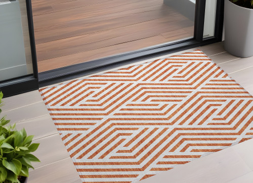 3' X 5' Orange and White Geometric Washable Non Skid Indoor Outdoor Area Rug