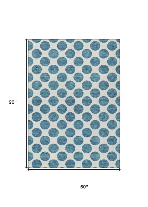 5' X 8' Teal Blue And Ivory Polka Dot Washable Indoor Outdoor Area Rug