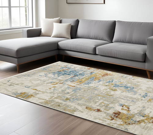 8' X 11' Beige Grey Gold Blue Rust And Teal Abstract Power Loom Stain Resistant Area Rug With Fringe