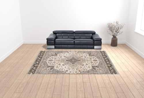 10' X 13' Ivory And Blue Oriental Power Loom Stain Resistant Area Rug With Fringe