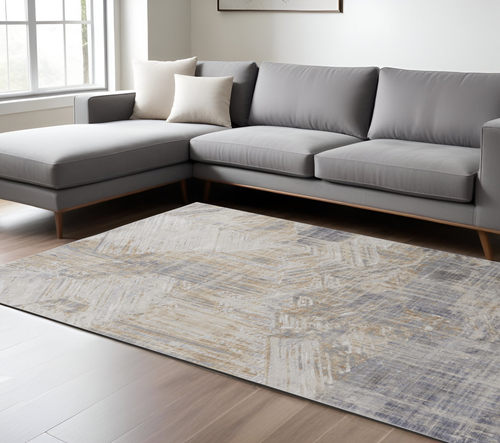 8' X 10' Ivory Tan And Blue Abstract Distressed Area Rug