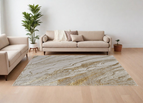 13' X 20' Ivory Brown and Gold Abstract Power Loom Area Rug