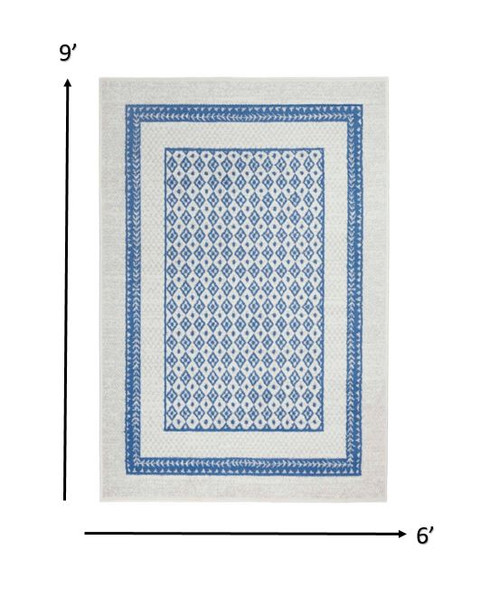 6' X 9' Ivory And Blue Geometric Area Rug Polypropylene Home Accent