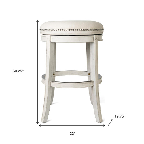 30" Bone and Antiqued White Fabric and Solid Wood Backless Bar Height Swivel Bar Chair