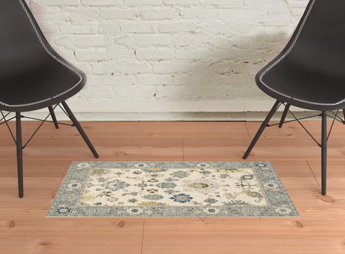 2' X 3' Ivory Blue Grey Teal Gold Green And Rust Oriental Power Loom Stain Resistant Area Rug With Fringe