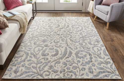 4' X 6' Blue Ivory And Tan Floral Distressed Stain Resistant Area Rug