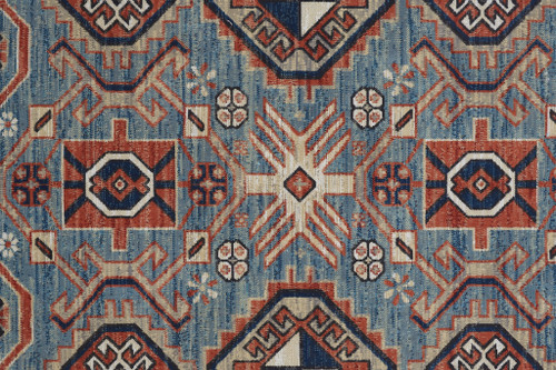 5' X 8' Blue Red And Tan Abstract Power Loom Distressed Stain Resistant Area Rug