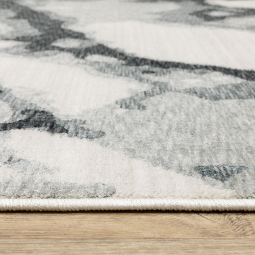 10' X 13' Blue Black And Ivory Abstract Area Rug With Fringe