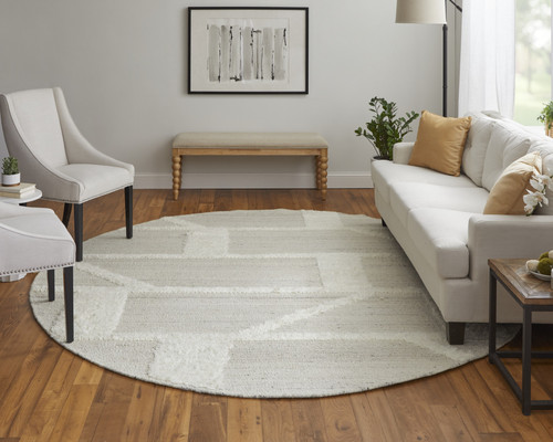 9' Tan And Ivory Wool Geometric Hand Woven Round Rug