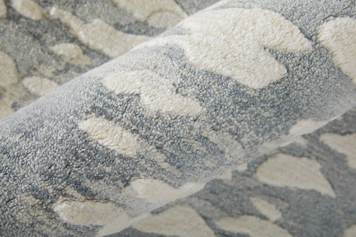 5' X 8' Blue And Ivory Abstract Hand Woven Area Rug