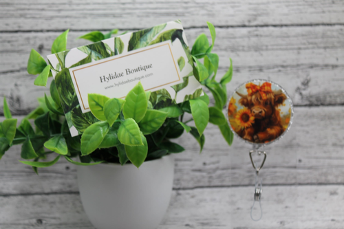 Highland Cow and Sunflowers Circle Badge Reel