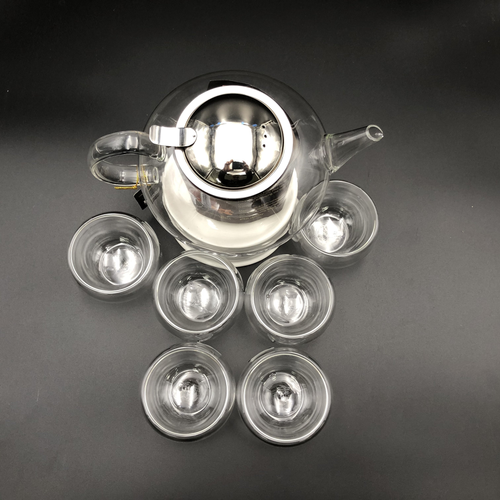 Large Asian tea thermo set with 6 bowls for serving and a porcelain warming stand