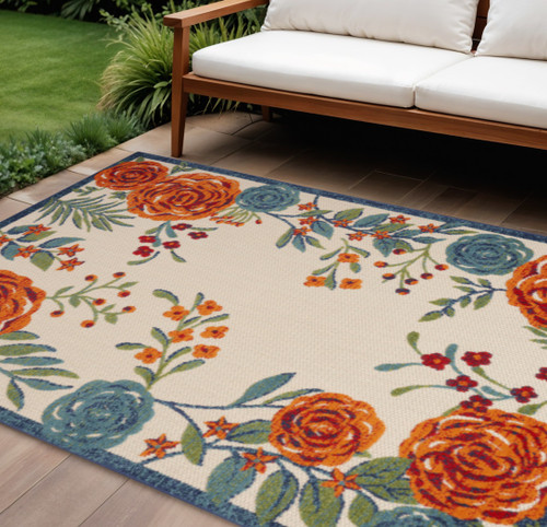 8' X 11' Ivory Blue And Orange Floral Indoor Outdoor Area Rug